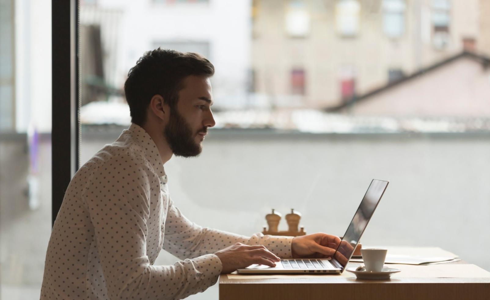 Professional investment analysis workspace with multiple monitors